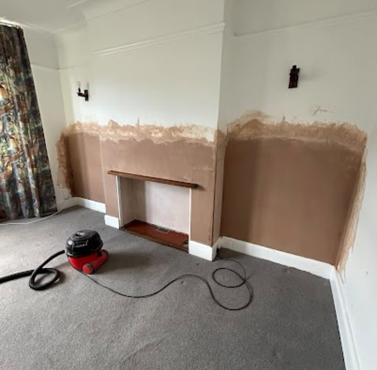 Completed plastering - living room with fireplace